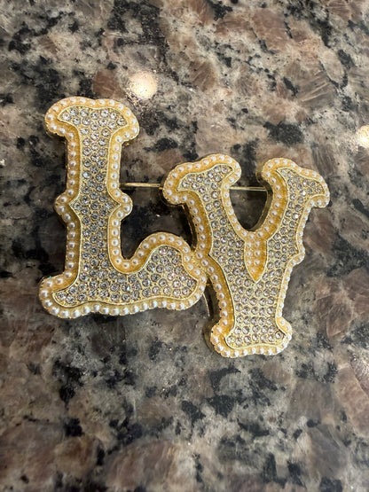 Gold and pedal brooch
