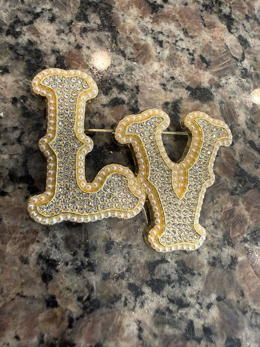 Gold and pedal brooch