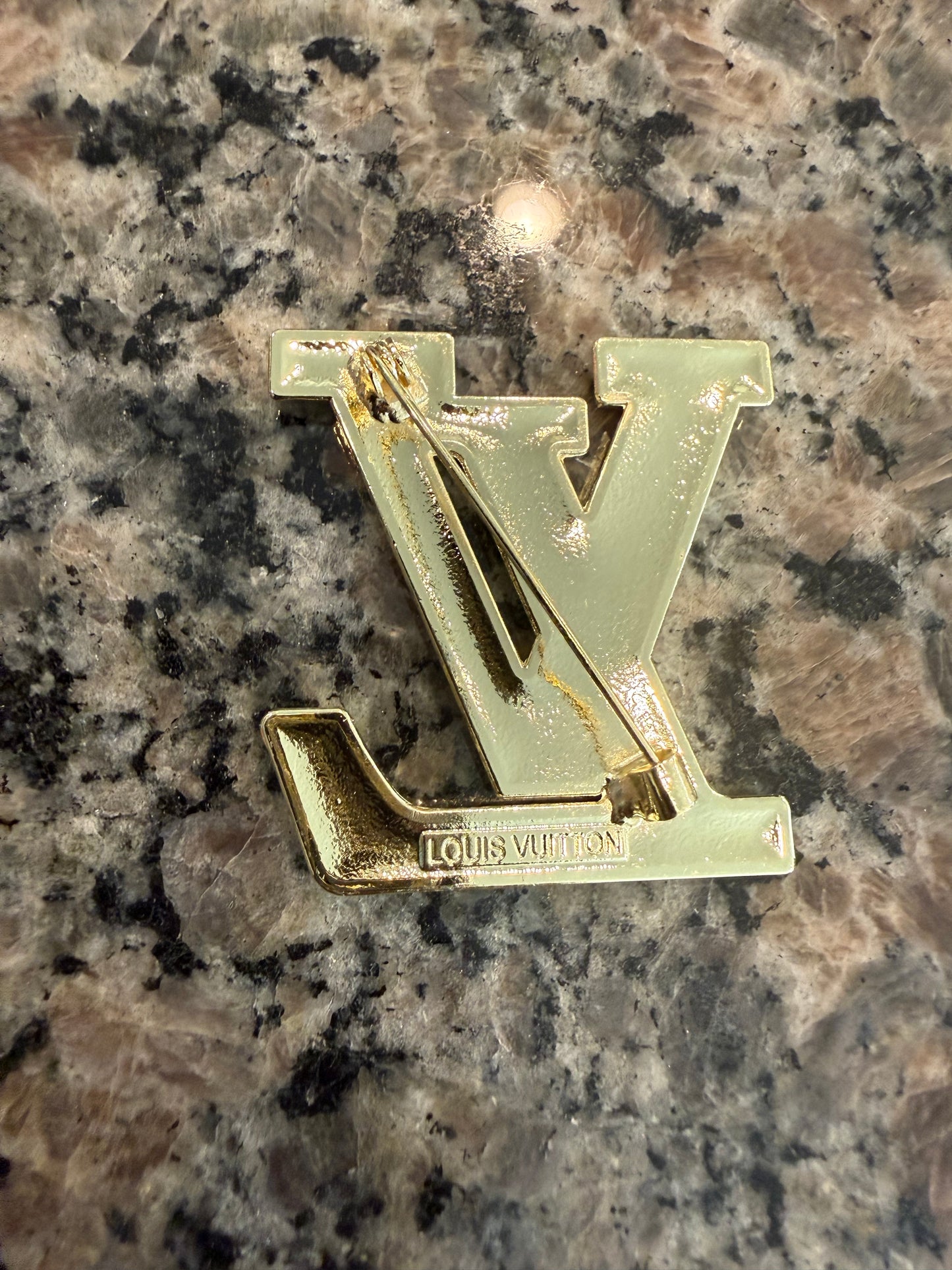 Gold and white brooch