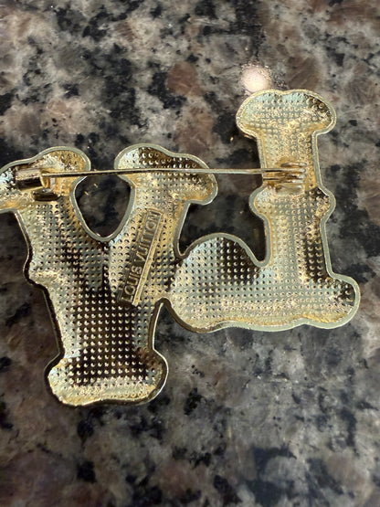 Gold and pedal brooch